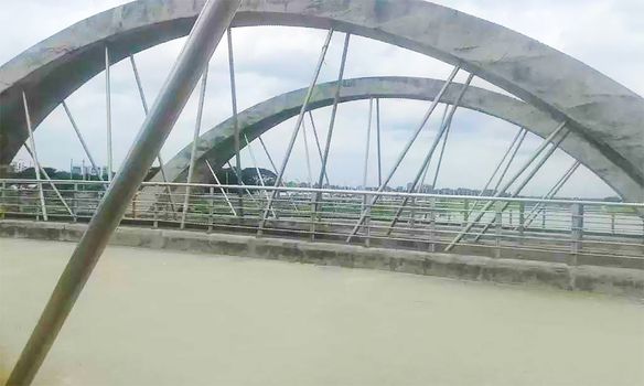 stylish concrete bridge on river with sky
