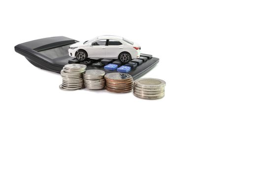 Coins stack with Calculator and car , concept Saving money for car or trade car for cash copy space