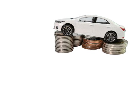 Coins stack with car, concept Saving money for car or trade car for cash copy space