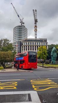 London, UK - July 8, 2020: Modern red double-decker bus is waiting for people in central London. Bus 30