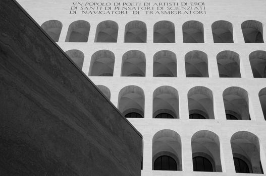 Rome, Italy. March 2019. EUR district. The facade with arches of the Palace of Italian Civilization or of the Civilization of Labor, now home to the Fendi group. Black and white picture. bottom wiew