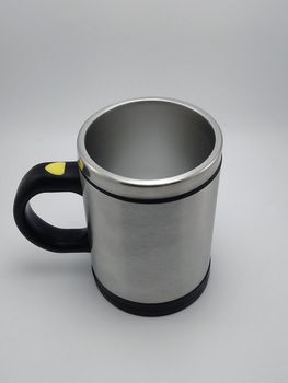 Self stirring mug made from aluminum metal use to stir liquid content before drinking