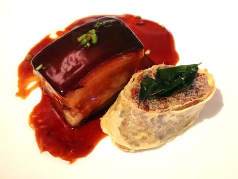 Juicy pork belly on white plate serve in hotel restaurant