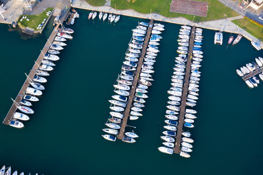 Aerial bird eye view of sailboats and yachts moored in Lovere port, Iseo lake near Bergamo,Italy.
