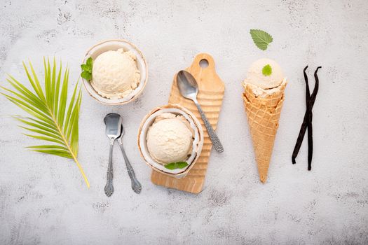 Coconut ice cream flavours in half of coconut setup on white stone background. Summer and Sweet menu concept.