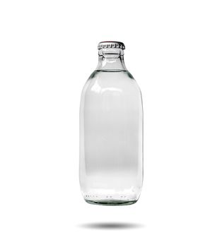 Closeup of glass bottles containing soda water that is sealed isolated on white background.