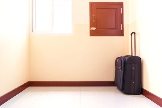 Luggage trolley was placed in the corner of the room.