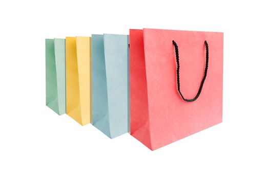 Group of multi colored of paper shopping bags isolated on white background.