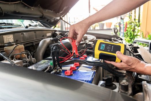 Engineering is using the instrument to measure the voltage and temperature of the car's battery.