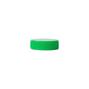 Green plastic bottle cap isolated on white background.