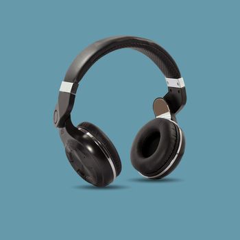 Black wireless headphone isolated on beautiful pastel color background, with clipping path.