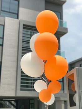 Group of orange and white balloons balloons for party decoration.