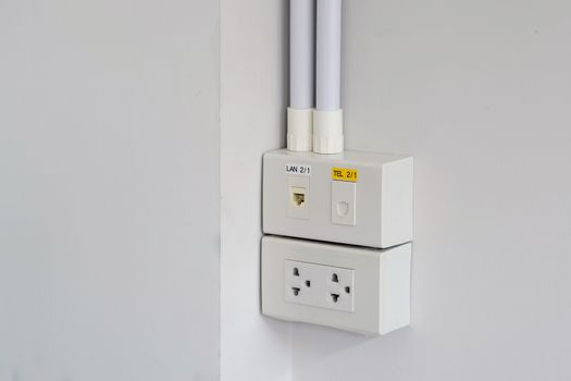 Closeup the power plugs, networks and telephone wall plugs for office and residential.
