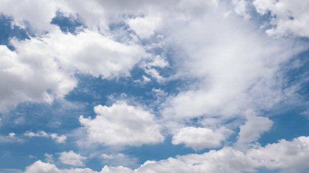 Beautiful white clouds and blue sky in the summer day.