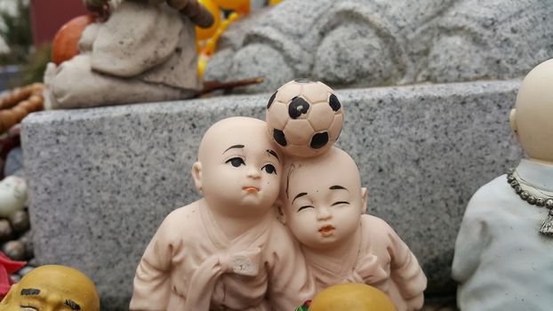 Closeup view of statues of religious monks. Buddha mini statue with beautiful background