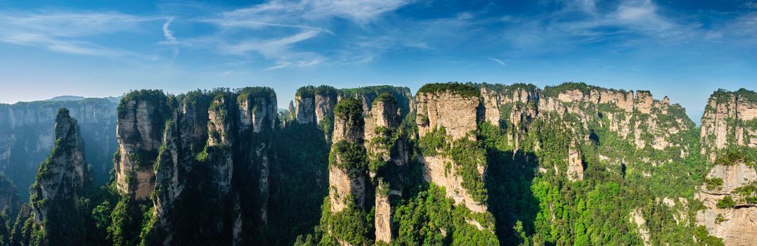 Panorama of famous tourist attraction of China Avatar mountains - Zhangjiajie stone pillars cliff mountains on sunset at Wulingyuan, Hunan, China