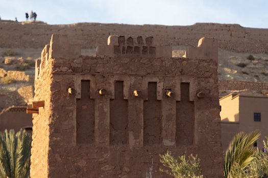 Ait Ben Haddou ksar Morocco, ancient fortress that is a Unesco Heritage site. Beautiful late afternoon light with honey, gold coloured mud brick construction the kasbah, or fortified town dates from 11th cent. and is on the former caravan route from the Sahara and Marrakech. The location has been used for many famous movies. High quality photo