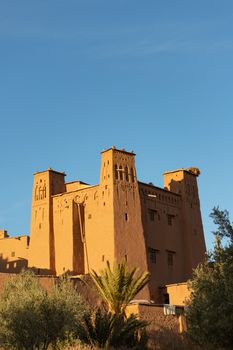Citadel at Ait Ben Haddou ksar Morocco, ancient fortress that is a Unesco Heritage site. Beautiful late afternoon light with honey, gold coloured mud brick construction the kasbah, or fortified town dates from 11th cent. and is on the former caravan route from the Sahara and Marrakech. The location has been used for many famous movies. High quality photo
