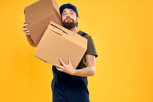 working man with box in hands delivery loading transportation service. High quality photo