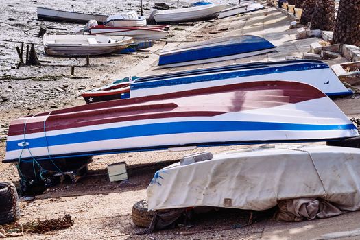 Fishing bay with boats at sea and in the mud and crabs walking in the sand