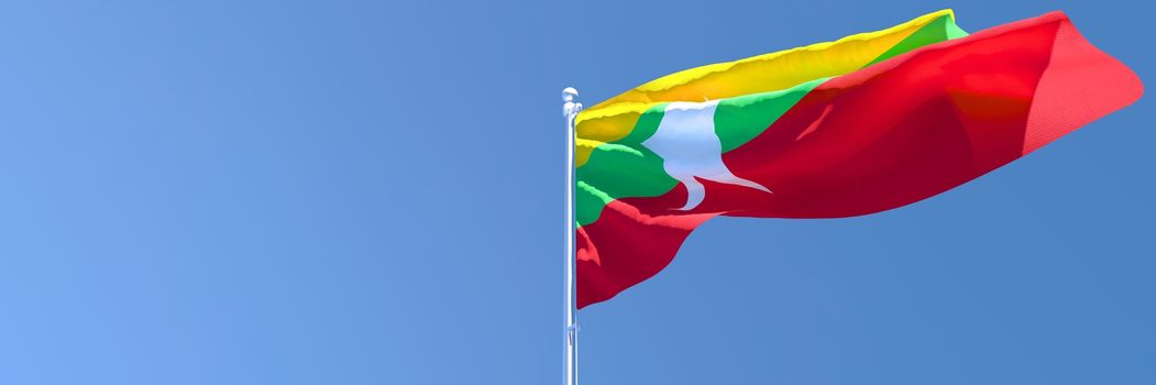 3D rendering of the national flag of Myanmar waving in the wind against a blue sky