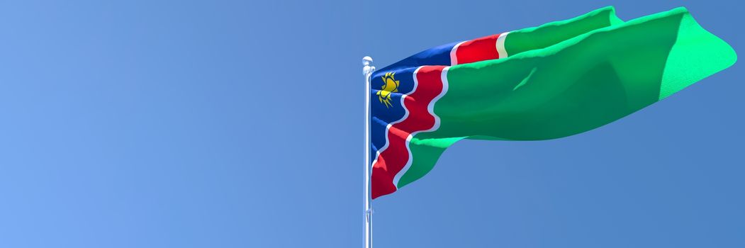 3D rendering of the national flag of Namibia waving in the wind against a blue sky