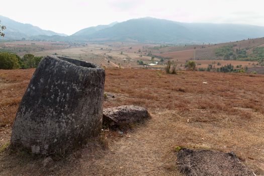 Plain of Jars, Phonsavan, Laos, historic site, the landscape of this area is dotted with hundreds of mysterious stone vessels or jars more than 2000 years old. Also the site of extensive bombing by America in the Vietnam War High quality photo