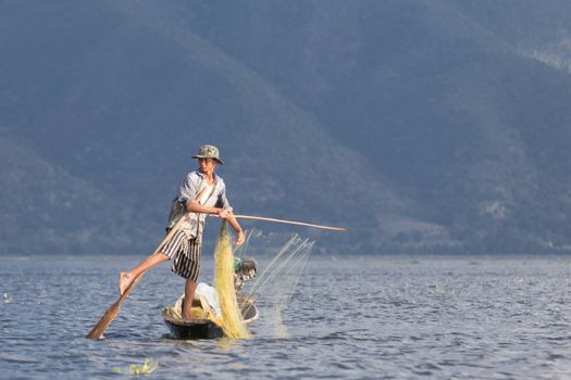 Inle Lake, Myanmar 12/16/2015 traditional Intha fisherman rowing with one leg . High quality photo