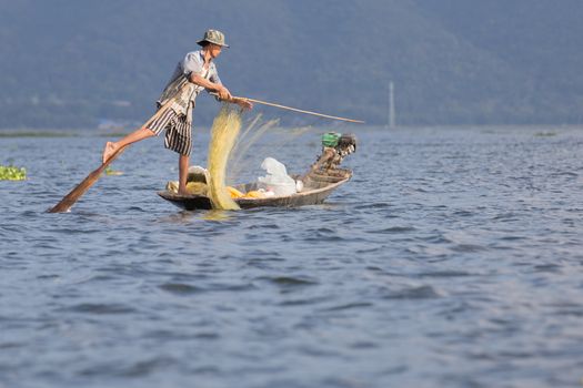 Inle Lake, Myanmar 12/16/2015 traditional Intha fisherman rowing with one leg . High quality photo