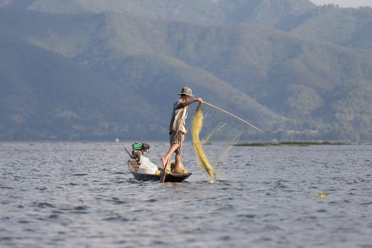 Inle Lake, Myanmar 12/16/2015 traditional Intha fisherman rowing with one leg . High quality photo