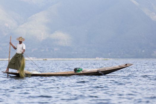 Inle Lake, Myanmar 12/16/2015 traditional Intha fisherman rowing with one leg . High quality photo