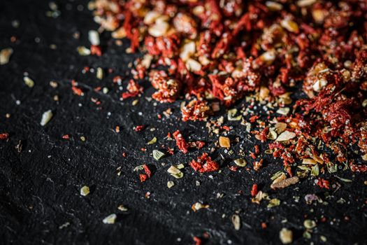 Dried tomato and chili pepper closeup on luxury stone background as flat lay, dry food spices and recipe ingredients