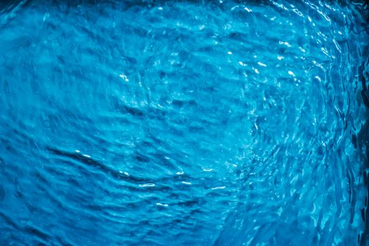 Blue water texture as abstract background, swimming pool and waves designs