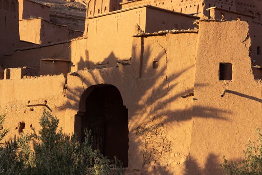 Ait Ben Haddou ksar Morocco, ancient fortress that is a Unesco Heritage site. Beautiful late afternoon light with honey, gold coloured mud brick construction the kasbah, or fortified town dates from 11th cent. and is on the former caravan route from the Sahara and Marrakech. The location has been used for many famous movies. High quality photo