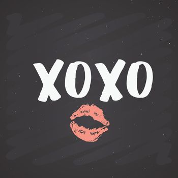 XOXO brush lettering sign, Grunge calligraphic hugs and kisses Phrase, Internet slang abbreviation XOXO symbols, vector illustration on chalkboard background.