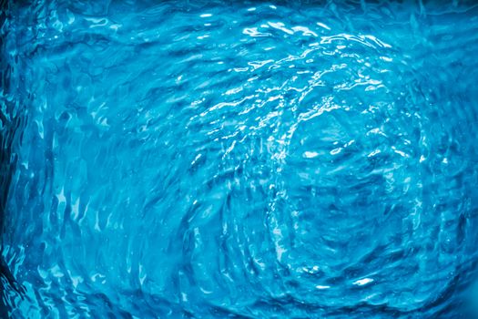 Blue water texture as abstract background, swimming pool and waves designs