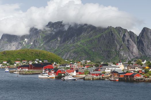 Scandinavian landscape with mountains and fjords. Panorama view of Reine village on Lofoten islands, Norway.