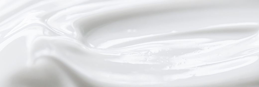 Pure white cream texture as abstract background, food substance or organic cosmetics