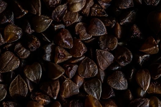 Buckwheat grain closeup, food texture and cook book backgrounds