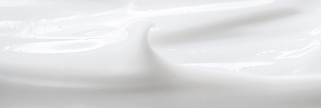 Pure white cream texture as abstract background, food substance or organic cosmetics