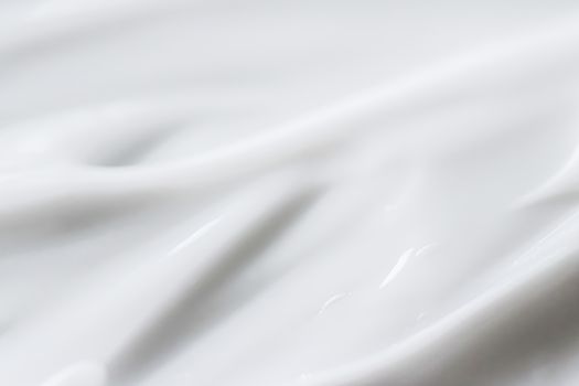 Pure white cream texture as abstract background, food substance or organic cosmetics