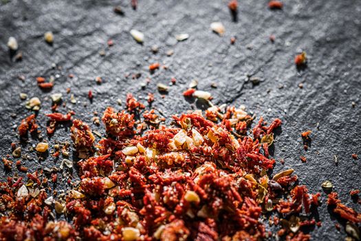 Dried tomato and chili pepper closeup on luxury stone background as flat lay, dry food spices and recipe ingredients