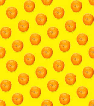 Seamless pattern with pumpkin. Pumpkin quality pattern. Autumn abstract seamless pattern made from Pumpkins on the yellow background.