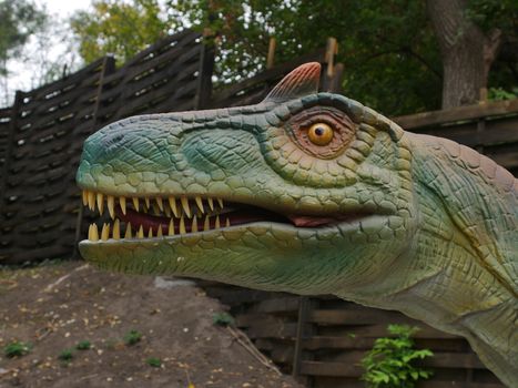 Dinosaurs figures in local autumn park, Ukraine