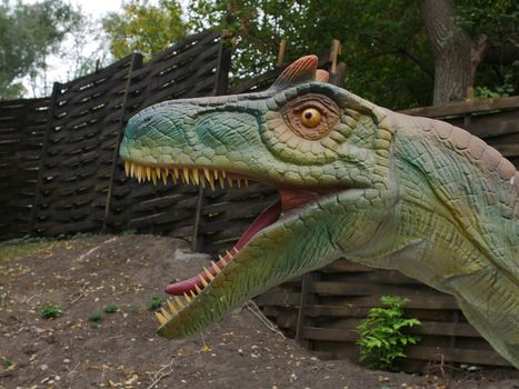 Dinosaurs figures in local autumn park, Ukraine