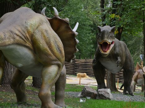 Dinosaurs figures in local autumn park, Ukraine