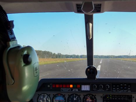 Antwerp, Belgium, October 2010: airplane cockpit view on tarmac runway, just before taking off.