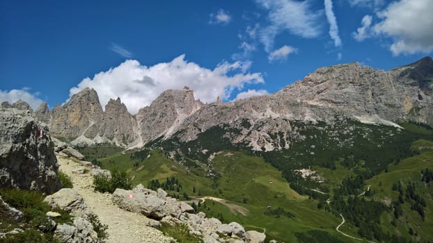 Val Gardena, Italy - 09/15/2020: Scenic alpine place with magical Dolomites mountains in background, amazing clouds and blue sky in Trentino Alto Adige region, Italy, Europe