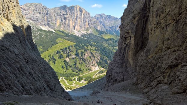 Val Gardena, Italy - 09/15/2020: Scenic alpine place with magical Dolomites mountains in background, amazing clouds and blue sky in Trentino Alto Adige region, Italy, Europe