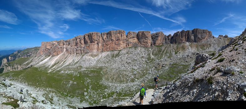 Val Gardena, Italy - 09/15/2020: Scenic alpine place with magical Dolomites mountains in background, amazing clouds and blue sky in Trentino Alto Adige region, Italy, Europe